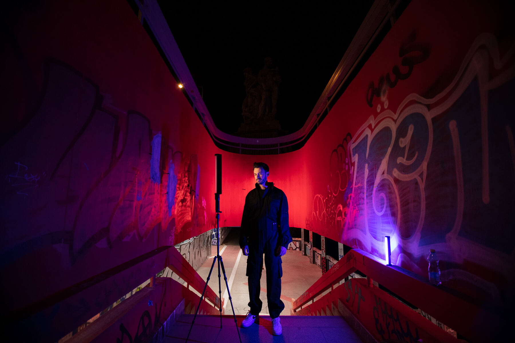 Bury in a red-lit curved underpass